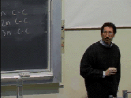 A single video frame showing Art Ellis in front of his class.  Click on the image to run video clip.